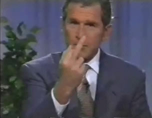 President Bush, in an undoctored press conference photo,
flips off the media